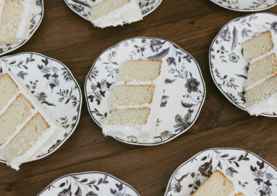 Flatlay view of vanilla cake on beautiful vintage black and white rental plates