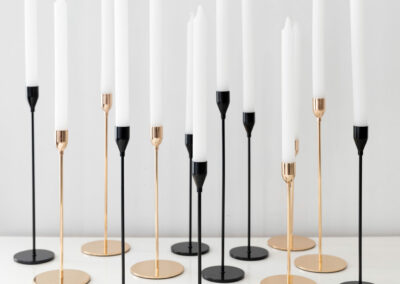 Gold and black candlestick holders for tabletop setups