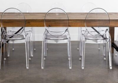 Ghost chairs set up with a farmhouse table